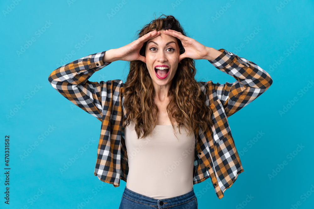 Young caucasian woman isolated on blue background with surprise expression Young caucasian woman isolated on blue background with surprise expression