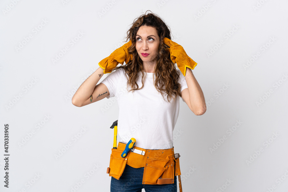 Young electrician man isolated on white background having doubts and thinking Young electrician man isolated on white background having doubts and thinking