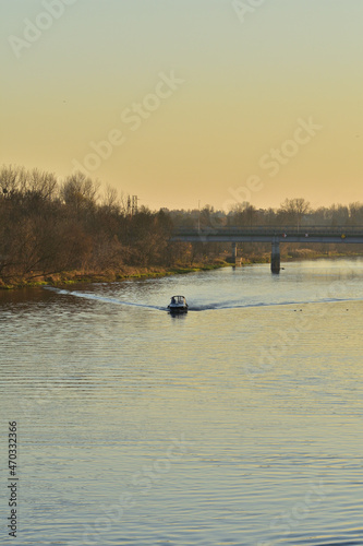 Speedboat on the river on a sunny autumn day. Summer.