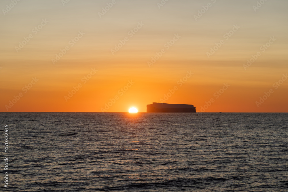 Sunset and tabular ice berg in the Gerlache Strait, Antarctica Sunset and tabular ice berg in the Gerlache Strait, Antarctica