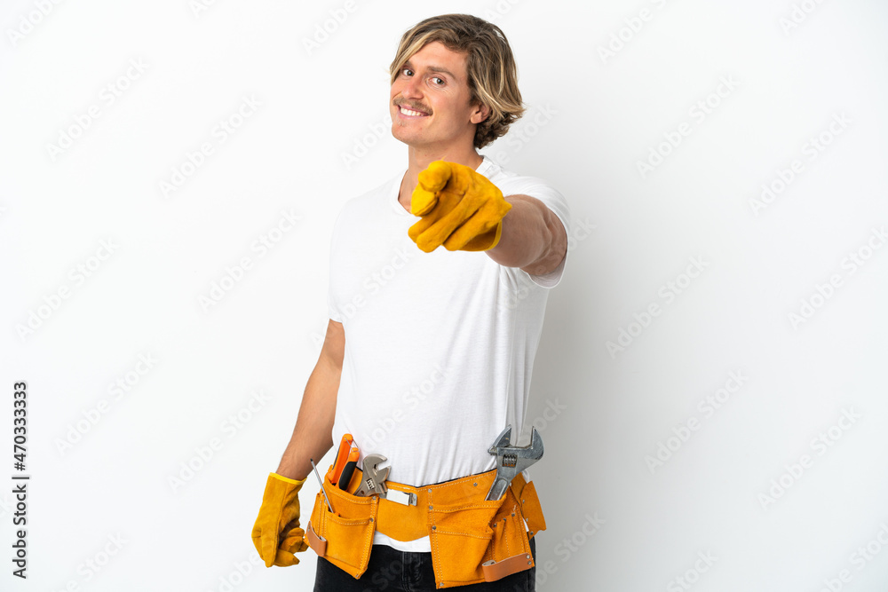 Young electrician blonde man isolated on white background pointing front with happy expression Young electrician blonde man isolated on white background pointing front with happy expression