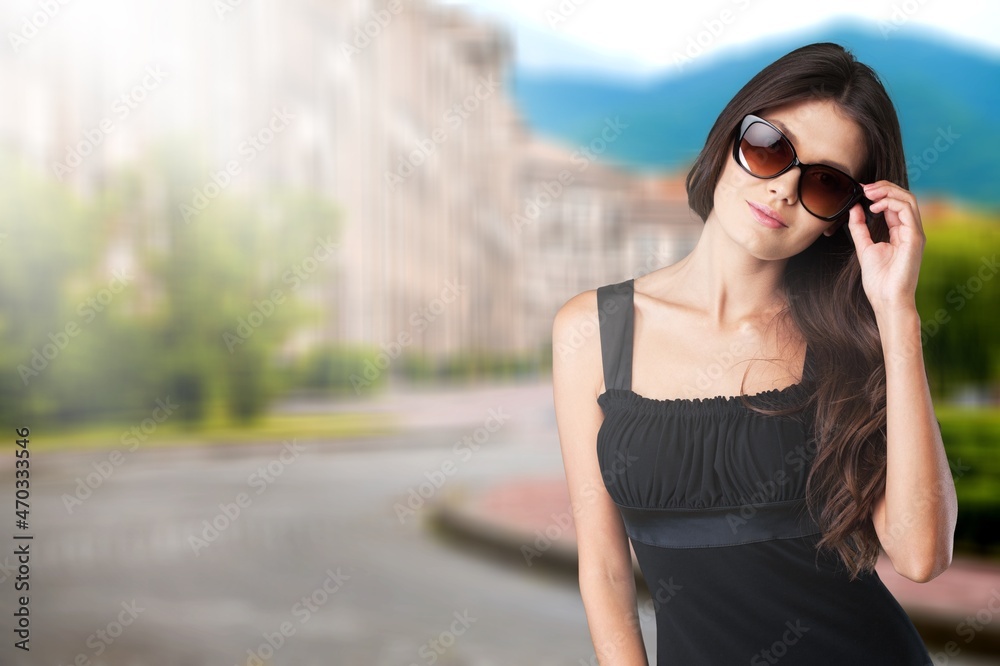 Young beautiful smiling woman in trendy summer clothes.