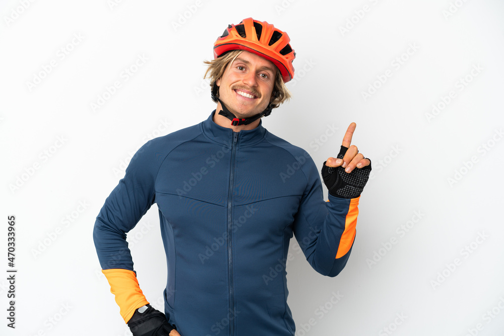 Young blonde cyclist man isolated on white background showing and lifting a finger in sign of the best