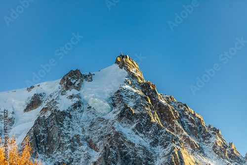 A mountain in the Mont Blanc massif in the Alps, the Aiguille de Midi. Elevation of around 3842 meters. It is a starting point for all sorts of extreme sports. October, 2021.