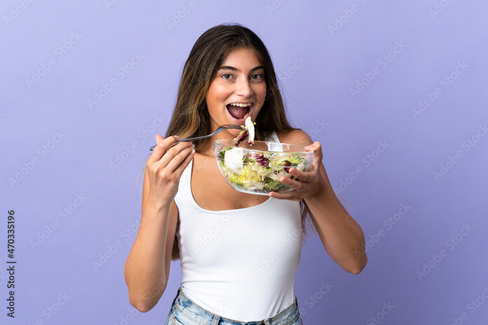 holding a bowl of salad with happy expression holding a bowl of salad with happy expression