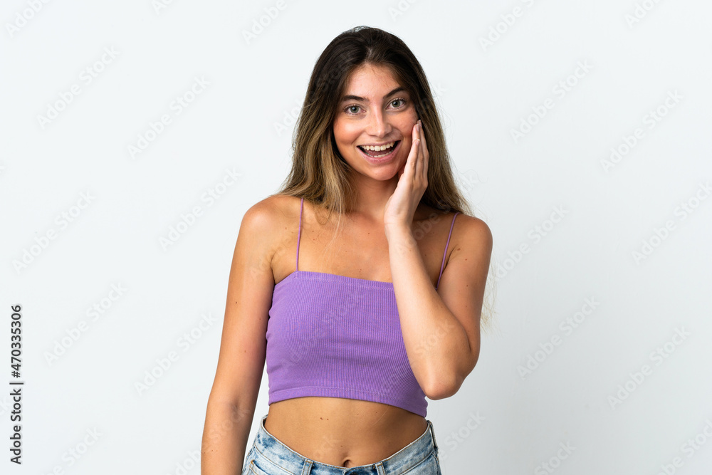 Fototapeta premium Young caucasian woman isolated on white background with surprise and shocked facial expression