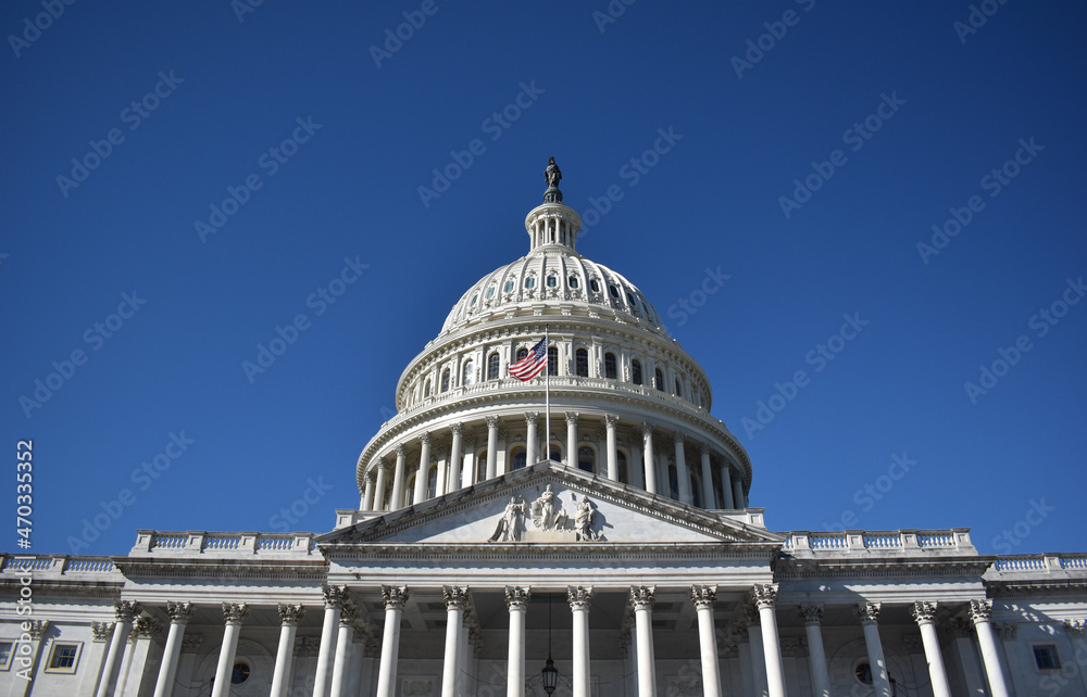 Obraz premium Washington, DC, USA - November 1, 2021: Looking Up at the U.S. Capitol Building from the Stairs on the East Side on a Bright, Clear Day in Autumn 