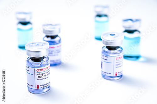 Coronavirus vaccine, COVID-19 vaccine, corona vaccination. Different vials of mRNA vaccine for injection on white background.