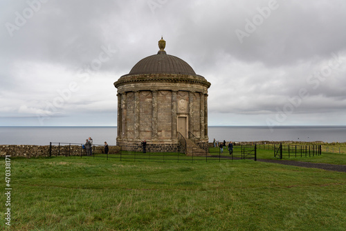 Mussenden Temple is a small circular building located on cliffs near Castlerock in County Londonderry, high above the Atlantic Ocean on the north-western coast of Northern Ireland. photo