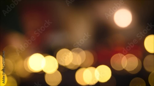 Christmas lights, shimmering abstract golden warm circles defocused. Blurred fairy lights. Out of focus holiday background. Light bokeh from Xmas tree. New Year theme, background 4k footage