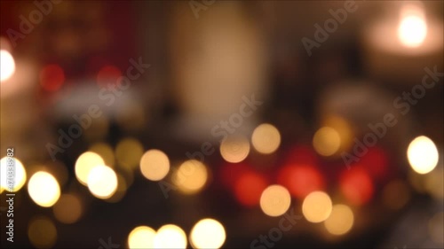 Christmas lights, shimmering abstract golden warm circles defocused. Blurred fairy lights. Out of focus holiday background. Light bokeh from Xmas tree. New Year theme, background 4k footage
