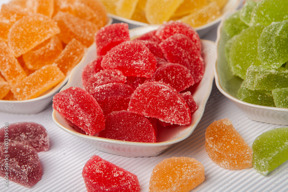 Dessert marmalade in the form of lemon and orange slices. The sweetness of jelly candy. Dessert marmalade in the form of lemon and orange slices. The sweetness of jelly candy.