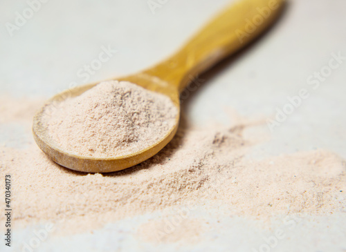 black volcanic indian salt in a wooden spoon