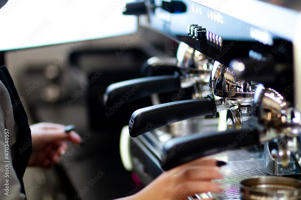 Close up pic of a proffesionnal coffee machine in a coffee shop preparing hot coffee Close up pic of a proffesionnal coffee machine in a coffee shop preparing hot coffee