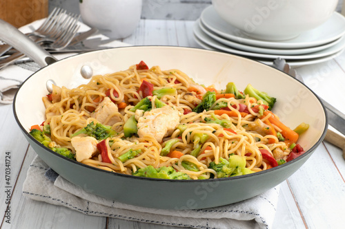 Chicken chow mein in a wok photo