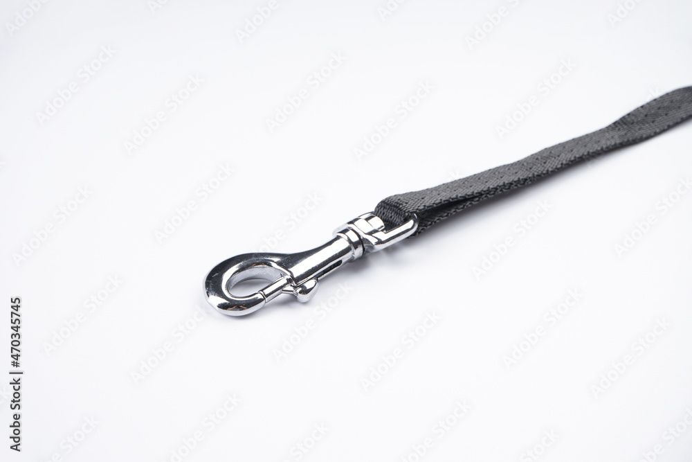 Dog leash with carabiner on a white background, close-up. Dog leash with carabiner on a white background, close-up.