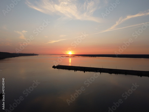 Sunset river rose clouds background
