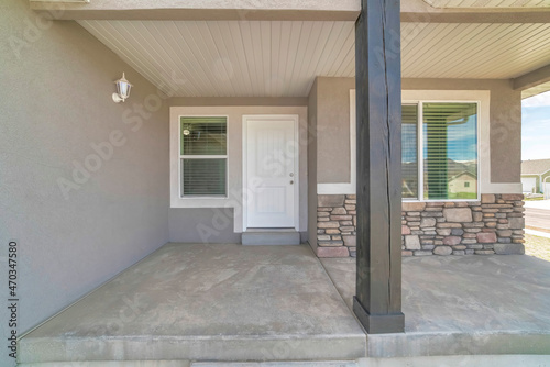 Front door exterior of a house with gray and white color palette