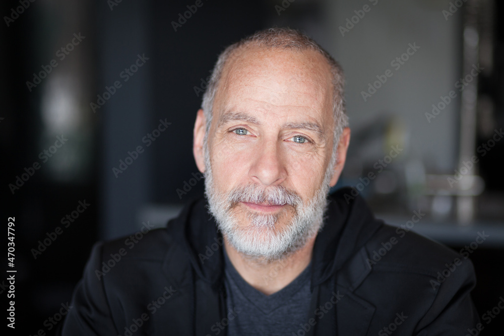 Serious Old Man looking At The Camera. With a gray beard. Sadness. Bad day at the office Serious Old Man looking At The Camera. With a gray beard. Sadness. Bad day at the office