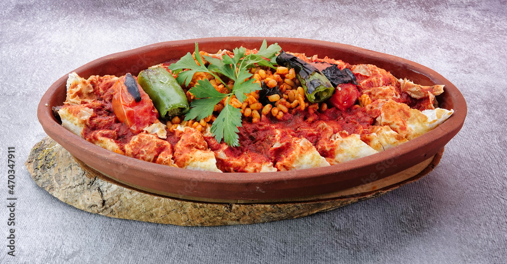 Turkish Beyti Kebap garnished with vegetables on a wooden tray - Turkish, Arabian Food Kebab Turkish Beyti Kebap garnished with vegetables on a wooden tray - Turkish, Arabian Food Kebab