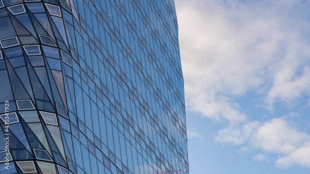 Business building with cloudy day blue sky. Cloud reflection on buildings air. Abstract financial background. Money talk or digital marketing backdrop use concept. High quality 4k resolution footage. Business building with cloudy day blue sky. Cloud reflection on buildings air. Abstract financial background. Money talk or digital marketing backdrop use concept. High quality 4k resolution footage.