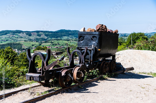 Wagon with bauxite rocks in front of the Farcu mine. Apuseni Mountains, Bihor County, Romania. photo