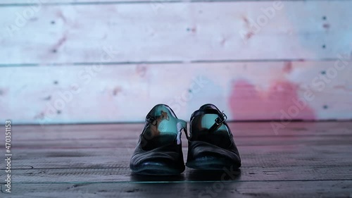 a girl puts on dancing shoes