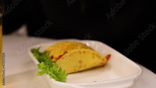 person holding a hot burrito