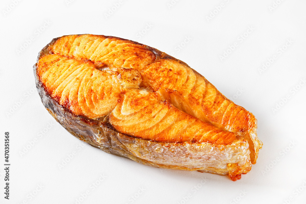 baked salmon steak on a white background