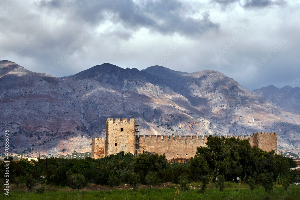 battlements of the medieval wall, Venetian castle Frangokastello and rocky mountains on the island of Crete