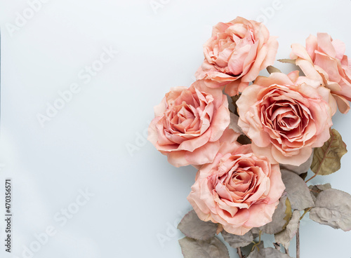 Flowers composition. Bouquet of pink roses in pastel colors. Flatlay.