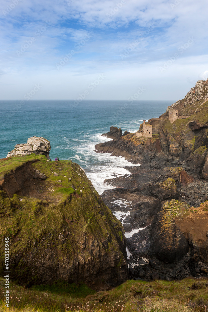 The famed Crowns engine houses cling to the foot of the cliffs on the wild Tin Coast: Botallack Mine, St Just, West Penwith, Cornwall, UK