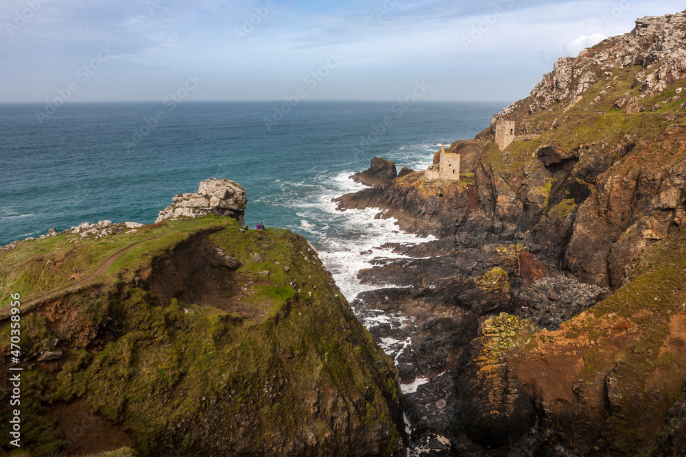 The famed Crowns engine houses cling to the foot of the cliffs on the wild Tin Coast: Botallack Mine, St Just, West Penwith, Cornwall, UK
