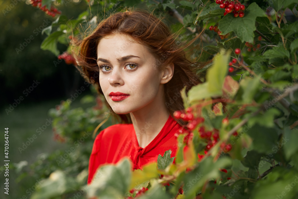 pretty woman in red shirt nature green leaves summer