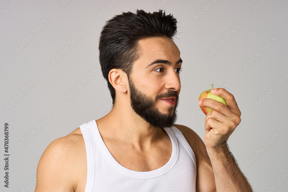 bearded man fruit food diet strength light background bearded man fruit food diet strength light background