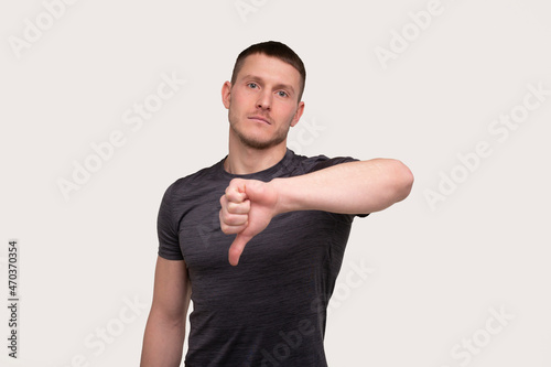 Man Showing Thump Down Isolated. Sportsman Thumb Down