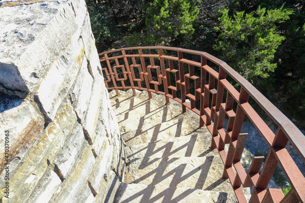 Beautiful limestone stairs leading down from a watchtower with the iron ...