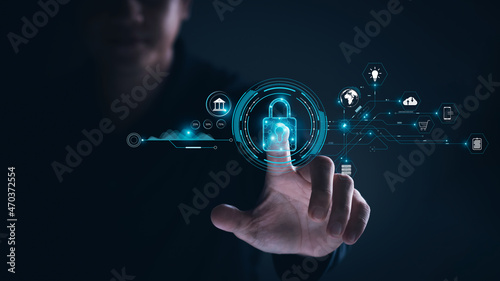 Cybersecurity and privacy concepts to protect data. Lock icon and internet network security technology. Businessmen protecting personal data on tablets and virtual interfaces.