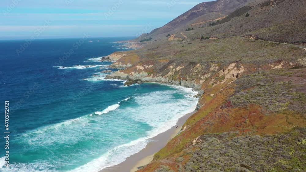 The Pacific Ocean washes onto the beautiful seashore of California, not far south of Monterey. The Pacific Coast Highway runs right along this colorful, scenic coast. The Pacific Ocean washes onto the beautiful seashore of California, not far south of Monterey. The Pacific Coast Highway runs right along this colorful, scenic coast.