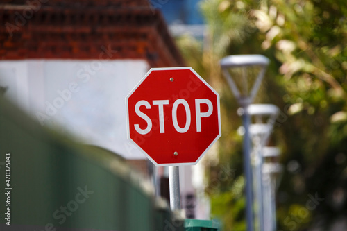 big red stop sign in the corner of a street in South Australia photo