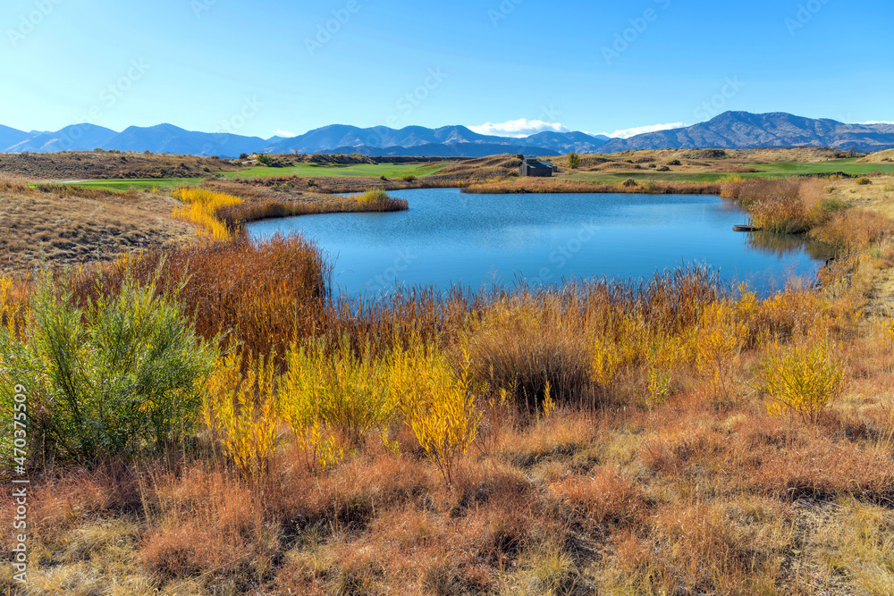 Autumn Mountain Pond - A colorful Autumn hilltop pond at Bear Creek Lake Park, Denver-Lakewood, Colorado, USA.
