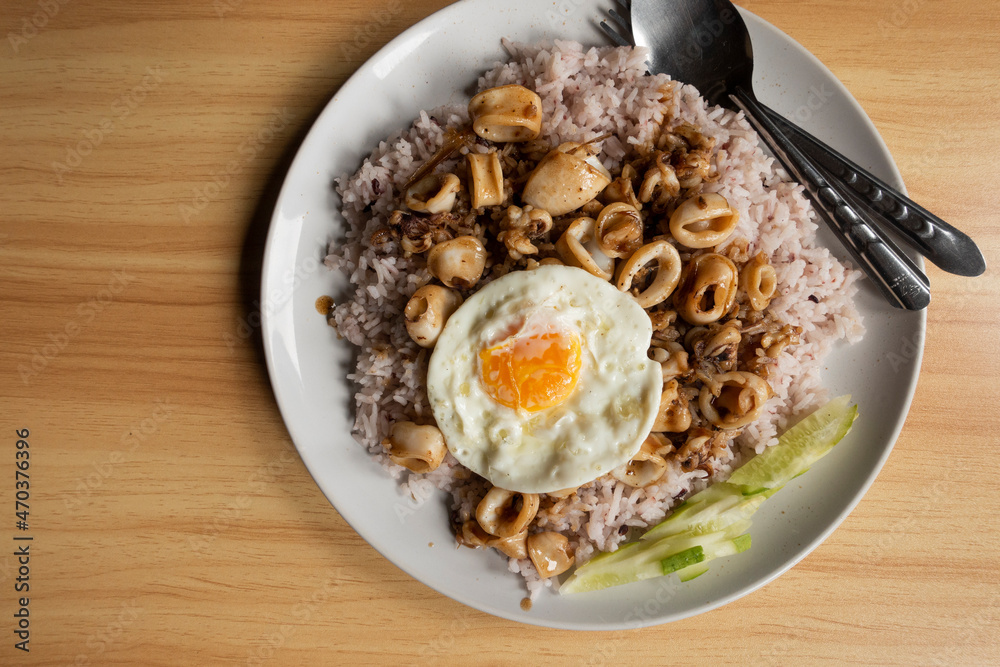 Khao Pad Ka Prao Pla Muek Kai Dao, thai food style Khao Pad Ka Prao Pla Muek Kai Dao, thai food style