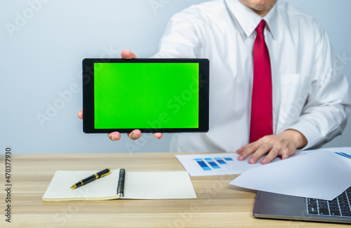 executive show green screen on tablet for making presentation