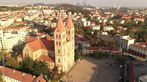 November 21, 2021 - Qingdao, China: Aerial view of St. Michael's Cathedral in Qingdao downtown photo