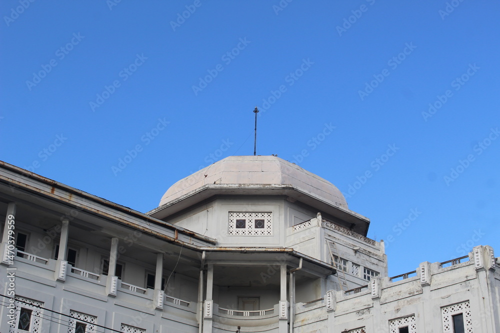 Old building with typical European architecture in white with a round dome with a clear sky background Old building with typical European architecture in white with a round dome with a clear sky background