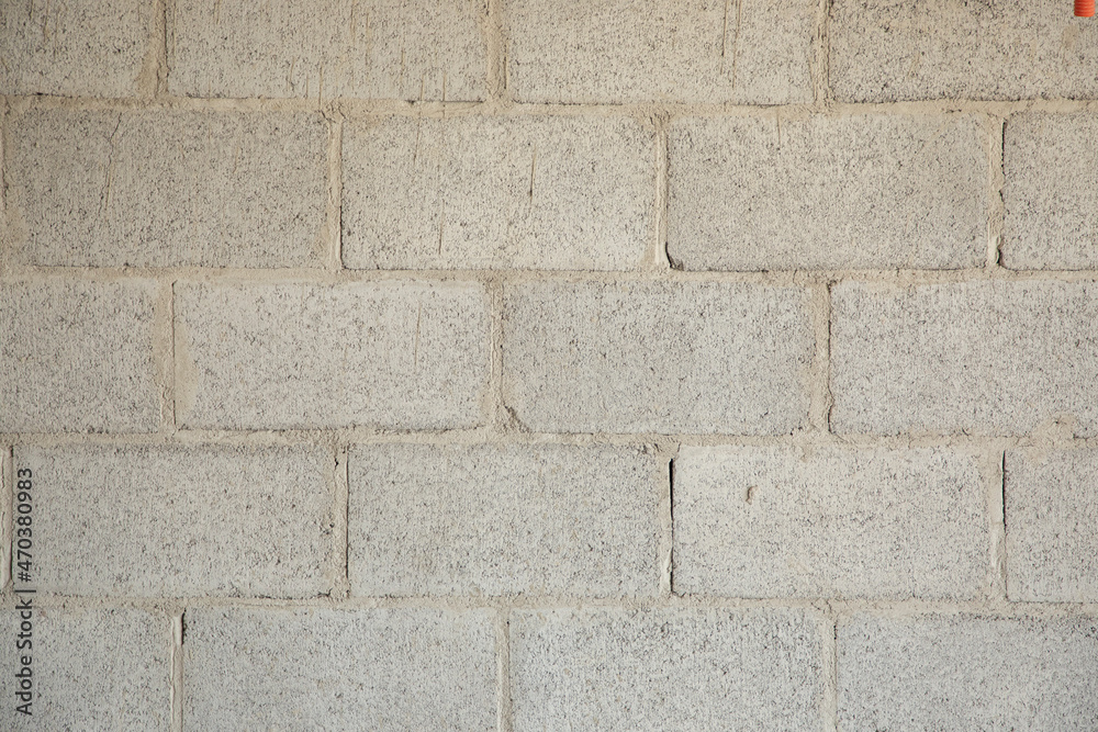 background of block wall or gray concrete bricks glued with cement background of block wall or gray concrete bricks glued with cement