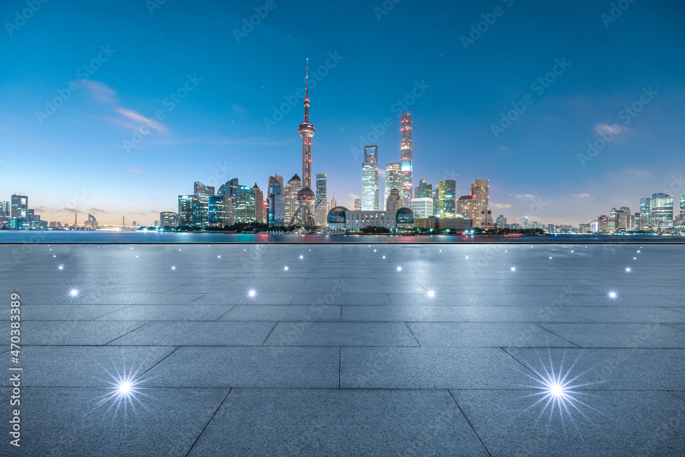 Empty square floor and modern city skyline with buildings in Shanghai at sunrise