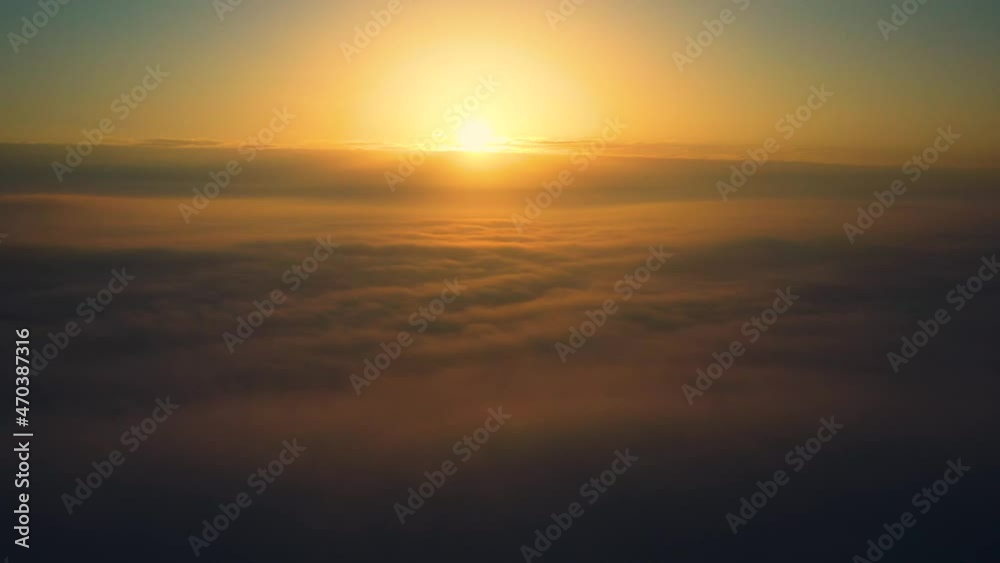 Bright dawn and clear sky above the clouds. View from a passenger plane. Bright dawn and clear sky above the clouds. View from a passenger plane.