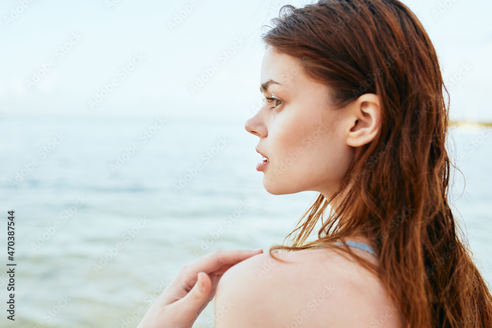 woman in blue swimsuit on the beach island lifestyle