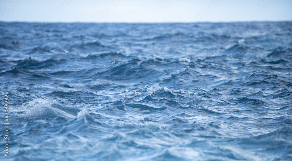 Fototapeta premium Abstract sea nature background. Water waves in sunlight with copy space. Tropical beach. Watering place. Aqua sea water surface.